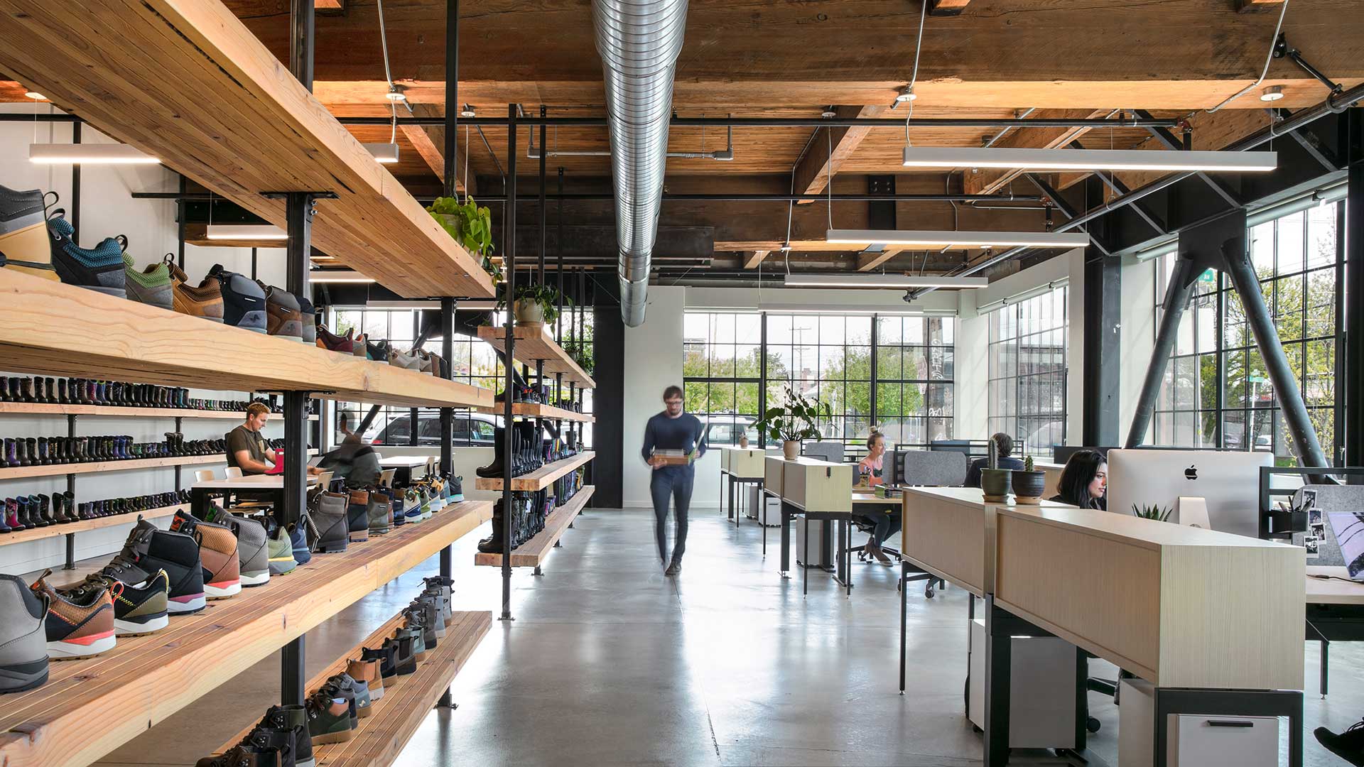 People in an open office space with shoe racks