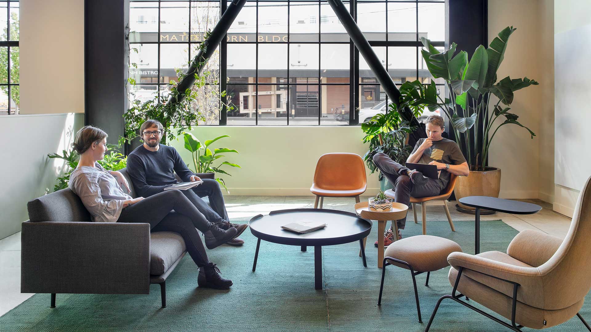 People sitting in an office lounge space